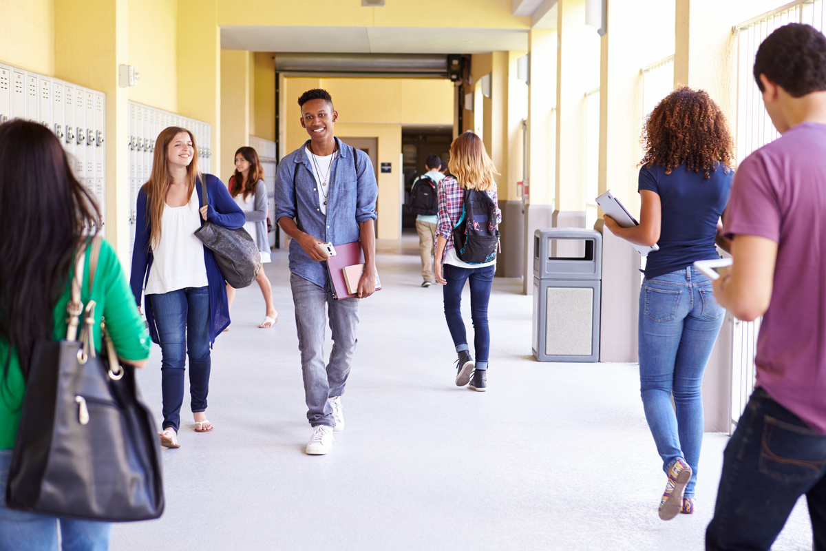 students walking down a hallway